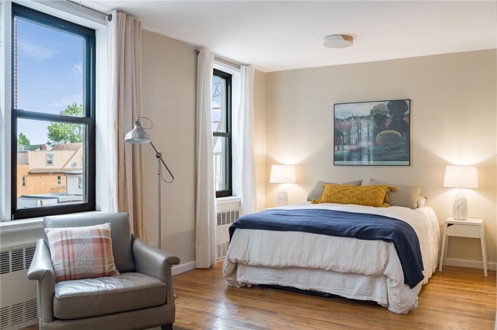 515 East 7th Street, Unit 3P Brooklyn, NY 11218 - Photo 5 of 14 a bedroom with a couch and a couch