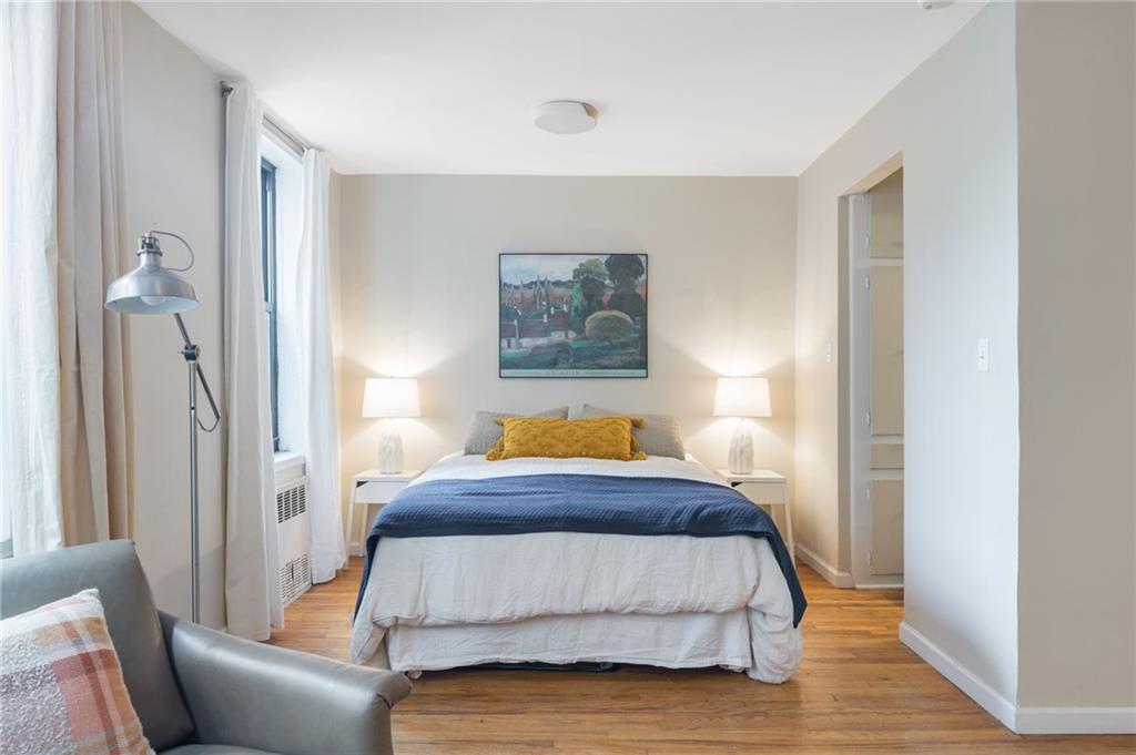 515 East 7th Street, Unit 3P Brooklyn, NY 11218 - Photo 6 of 14 a bedroom with a bed couch and a window