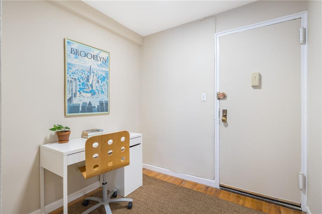 515 East 7th Street, Unit 3P Brooklyn, NY 11218 - Photo 10 of 14 a room with a table and a workspace