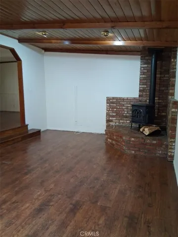 a view of room with wooden floor