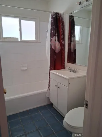 a bathroom with a sink a toilet and bathtub