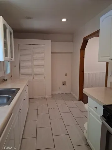 a kitchen with a sink and cabinets