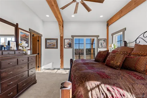 a bedroom with a large bed and a dresser