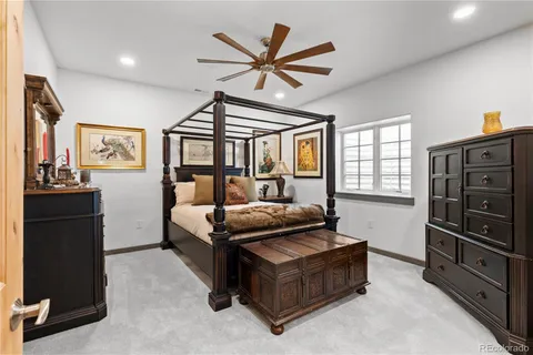 a bathroom with a granite countertop sink a mirror and shower