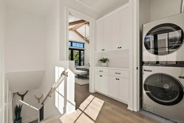 a kitchen with stainless steel appliances a stove a sink and a window