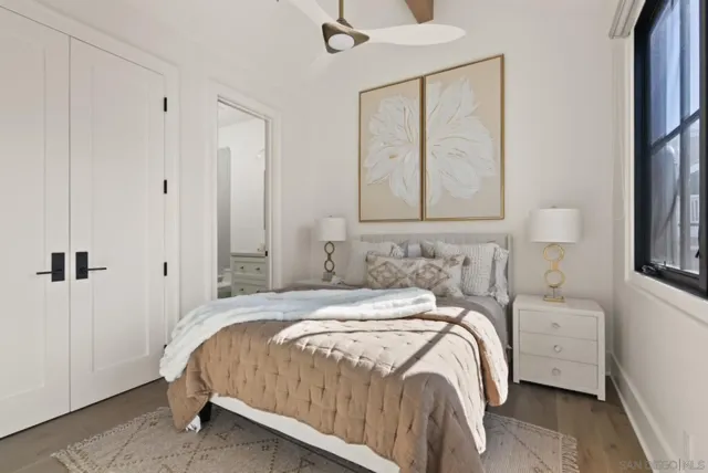 a bedroom with a bed and a window