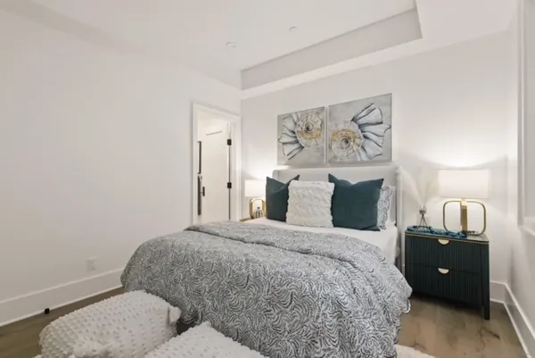 a bedroom with a bed and a couch