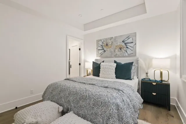 a bedroom with a bed and a couch