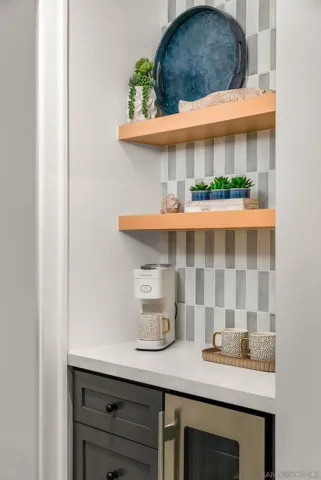 a kitchen with a sink a counter and cabinets