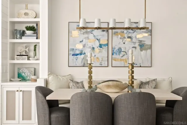 a dining room with furniture and window