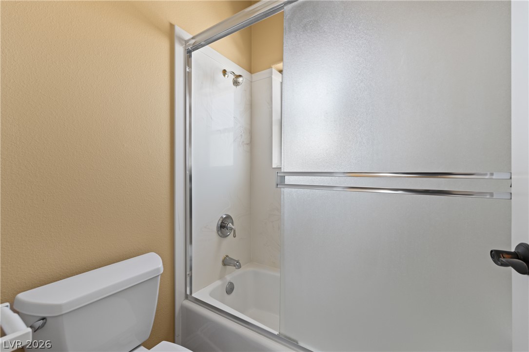 575 Gann Avenue Logandale, NV 89021 - Photo 50 of 75 Casita: Bathtub and shower combo featuring a clean sliding frosted glass door.