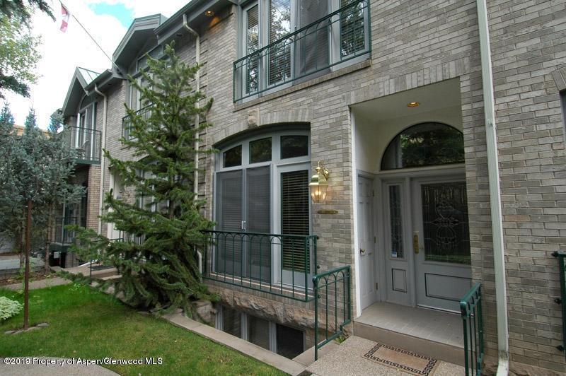814 East Cooper Avenue Aspen, CO 81611 - Photo 14 of 15 a view of a door of the house with a tree