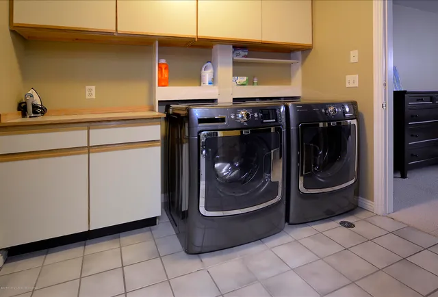 a utility room with washer and dryer