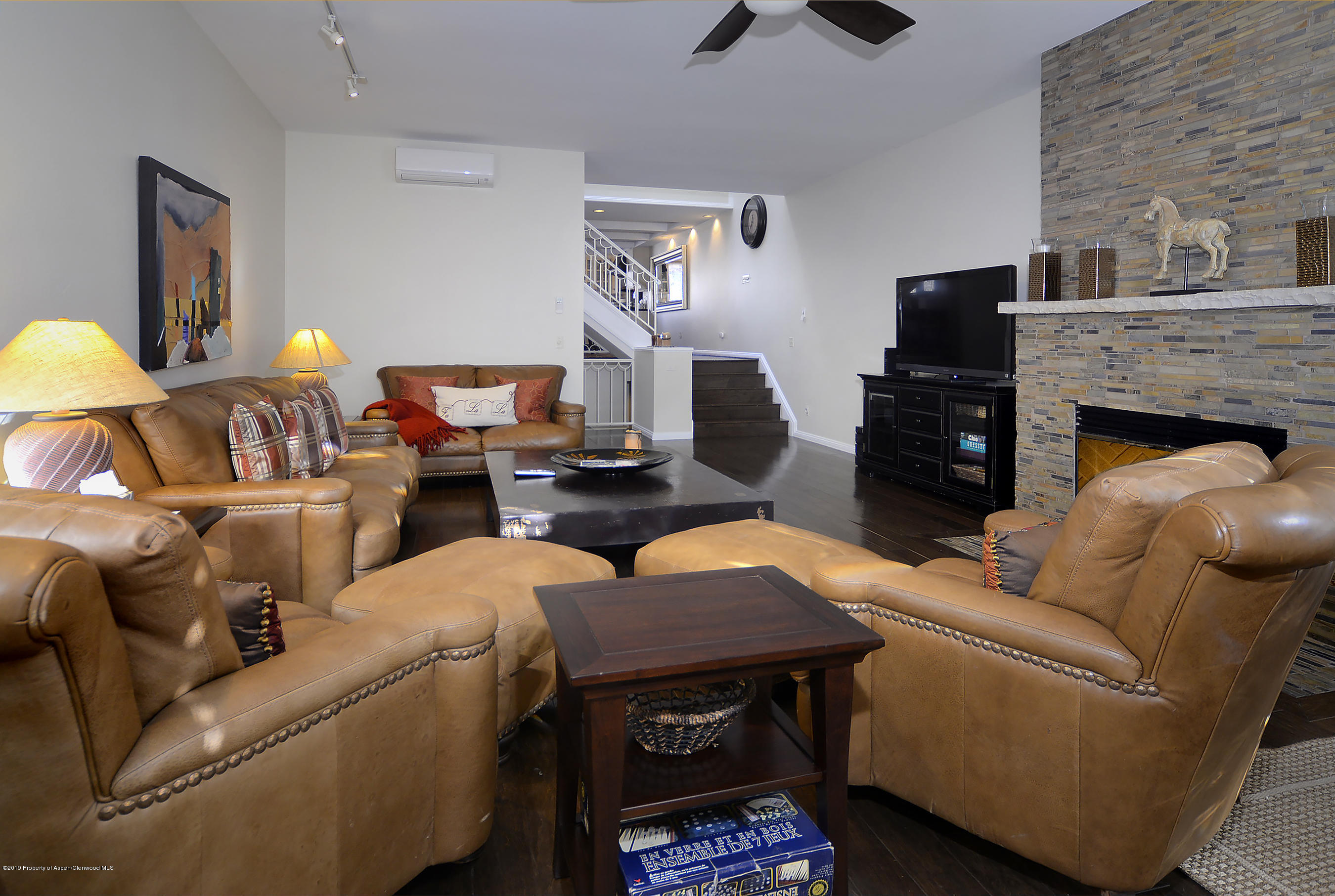 814 East Cooper Avenue Aspen, CO 81611 - Photo 4 of 15 a living room with furniture and a fireplace