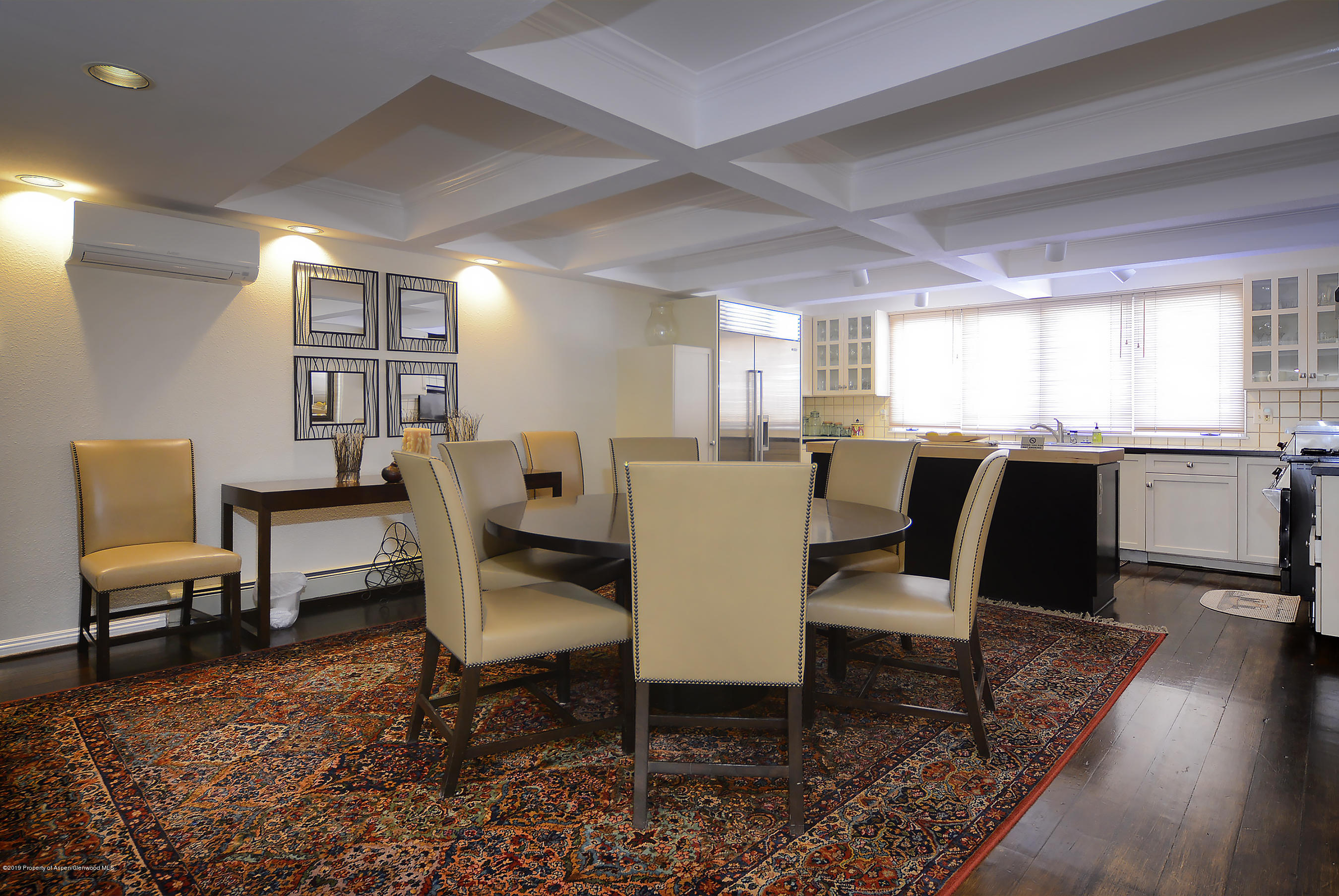 814 East Cooper Avenue Aspen, CO 81611 - Photo 6 of 15 a view of a dining room with furniture window and wooden floor