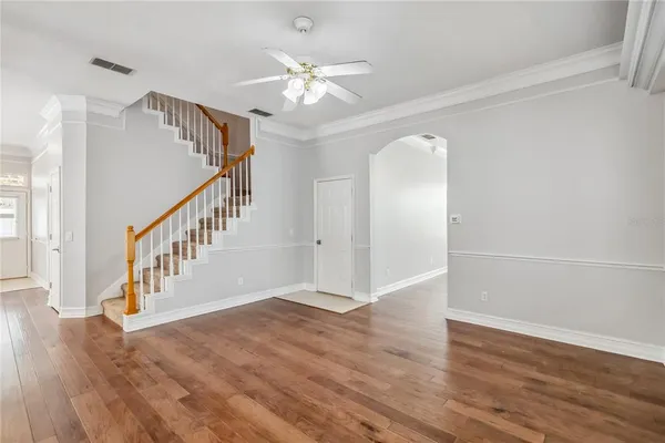 a view of an entryway with wooden floor