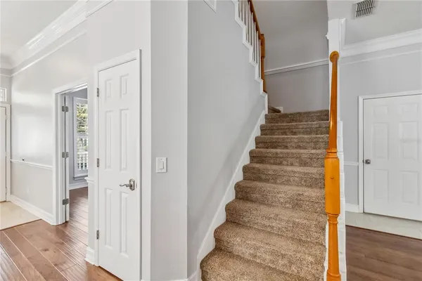 a view of an entryway with wooden floor