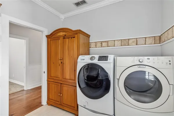 a utility room with dryer and washer