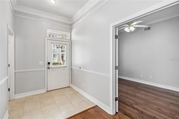 a view of a hallway with wooden floor
