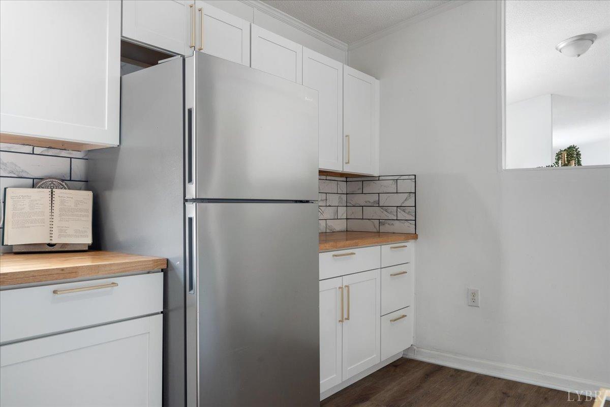 460 Belcher Road Penhook, VA 24137 - Photo 8 of 38 a kitchen with white cabinets and white appliances