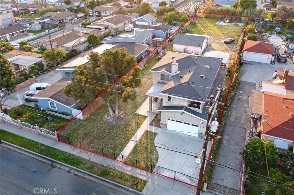 an aerial view of a residential apartment building with a yard