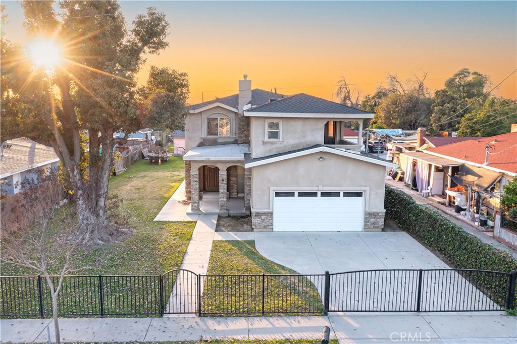 a aerial view of a house with a yard