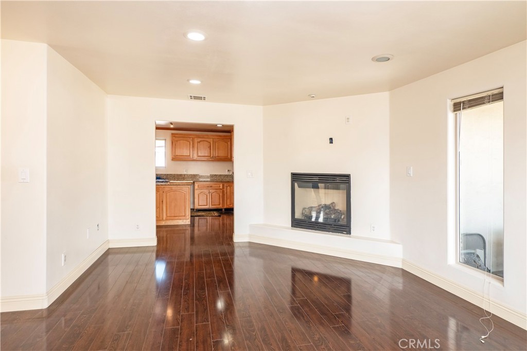 4459 Merced Avenue Baldwin Park, CA 91706 - Photo 11 of 40 a view of a room with wooden floor and windows