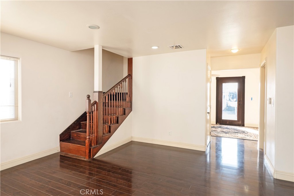 4459 Merced Avenue Baldwin Park, CA 91706 - Photo 13 of 40 a view of an entryway with wooden floor