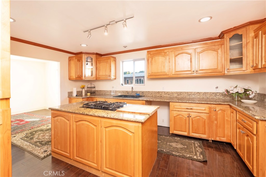 4459 Merced Avenue Baldwin Park, CA 91706 - Photo 14 of 40 a kitchen with stainless steel appliances granite countertop a sink and cabinets