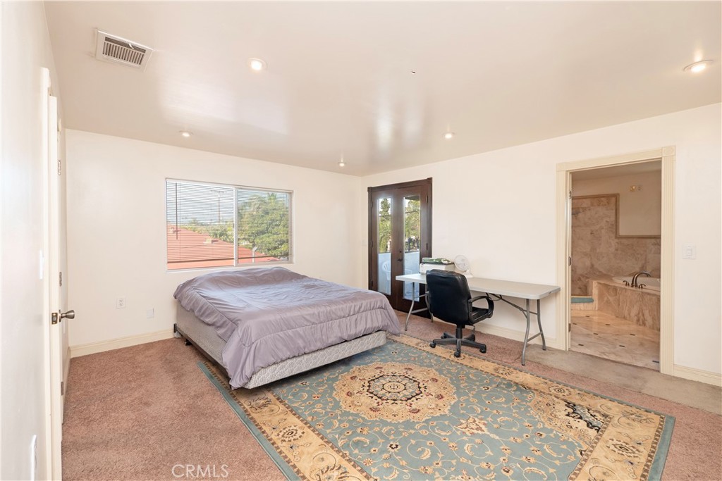 4459 Merced Avenue Baldwin Park, CA 91706 - Photo 20 of 40 a living room with a bed furniture and next to a window