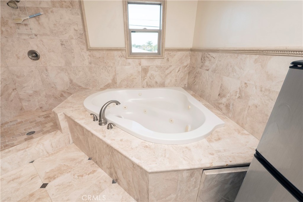 4459 Merced Avenue Baldwin Park, CA 91706 - Photo 24 of 40 a bathroom with a bathtub