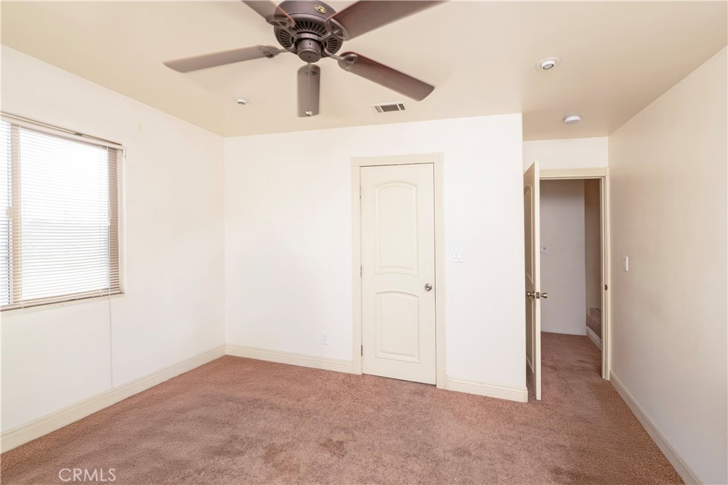 4459 Merced Avenue Baldwin Park, CA 91706 - Photo 35 of 40 an empty room with fan and windows