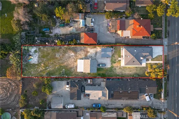 an aerial view of houses with outdoor space