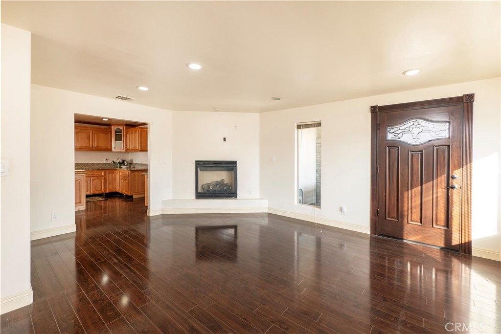 4459 Merced Avenue Baldwin Park, CA 91706 - Photo 10 of 40 a view of a livingroom with wooden floor and a flat screen tv
