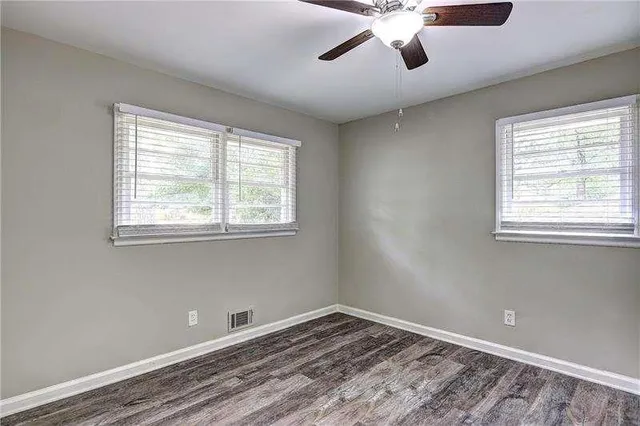 a view of room with window and ceiling fan