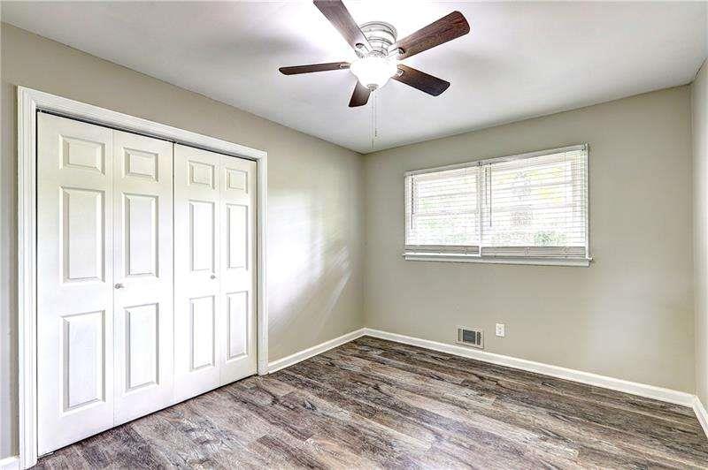 4973 White Boulevard Southwest Mableton, GA 30126 - Photo 15 of 22 a view of empty room with wooden floor and fan