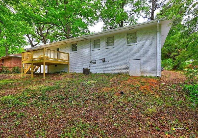 4973 White Boulevard Southwest Mableton, GA 30126 - Photo 21 of 22 a backyard of a house with table and chairs