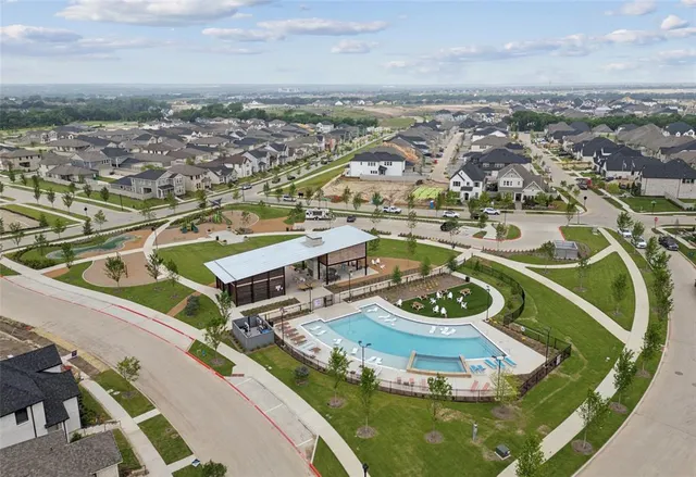 a view of a balcony dining table and chairs with wooden floor