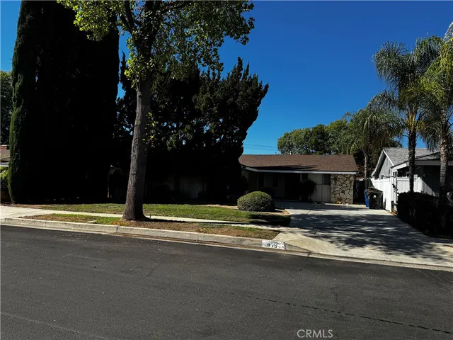a view of house with outdoor space and trees