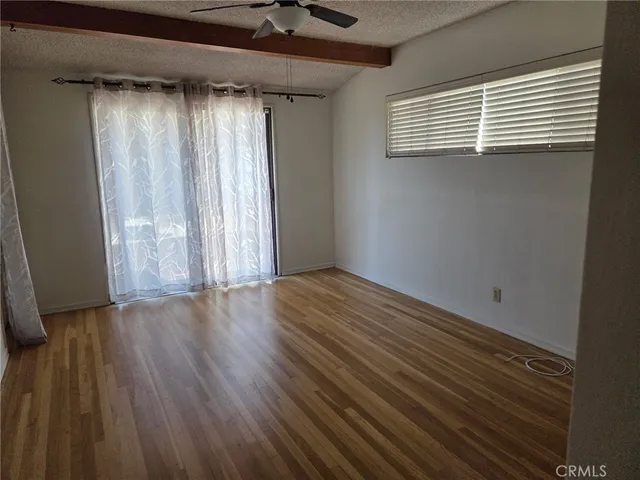an empty room with wooden floor