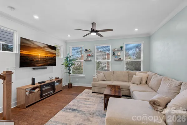 a living room with furniture and a flat screen tv