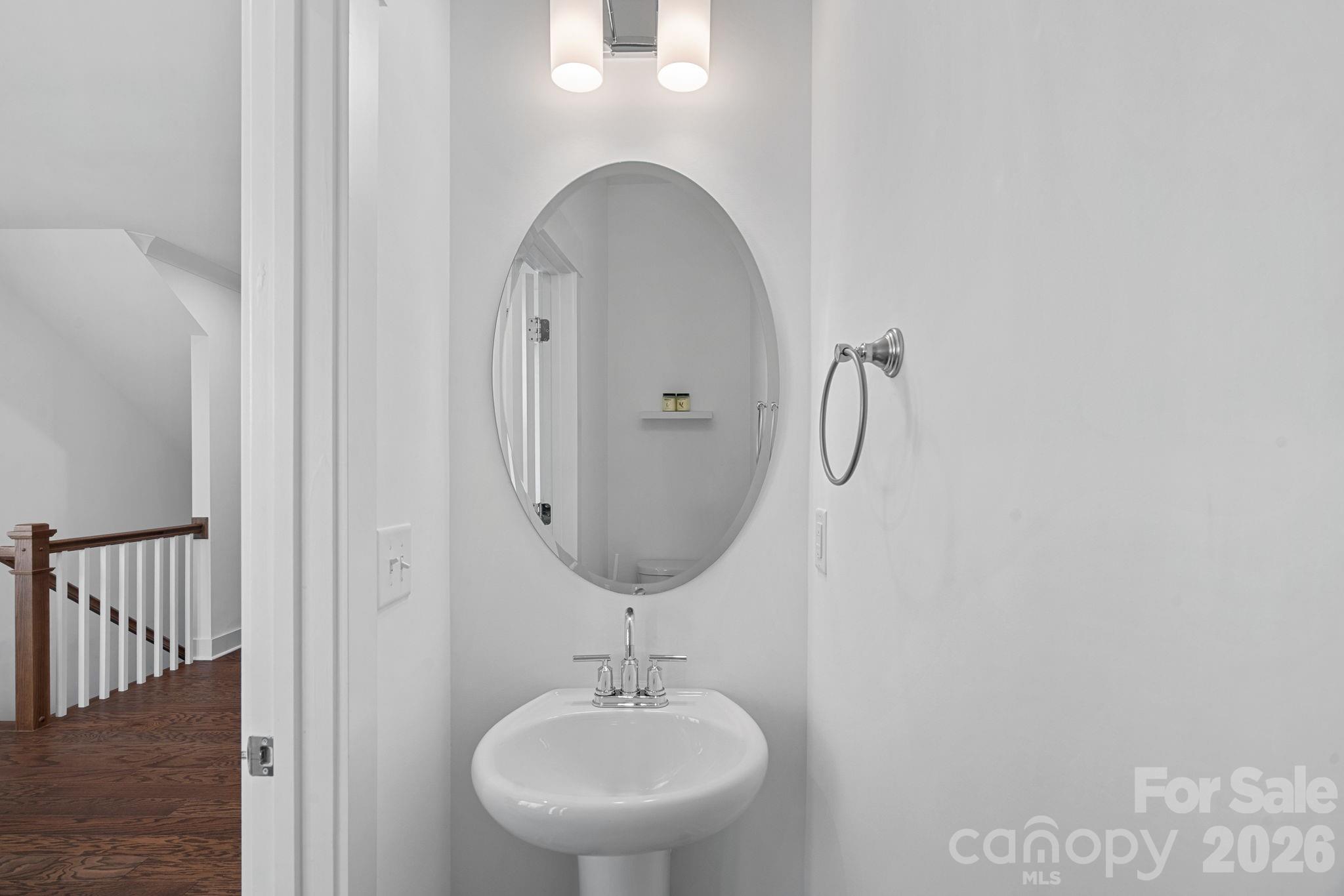 4012 Capital Ridge Charlotte, NC 28205 - Photo 11 of 28 a bathroom with a sink and mirror
