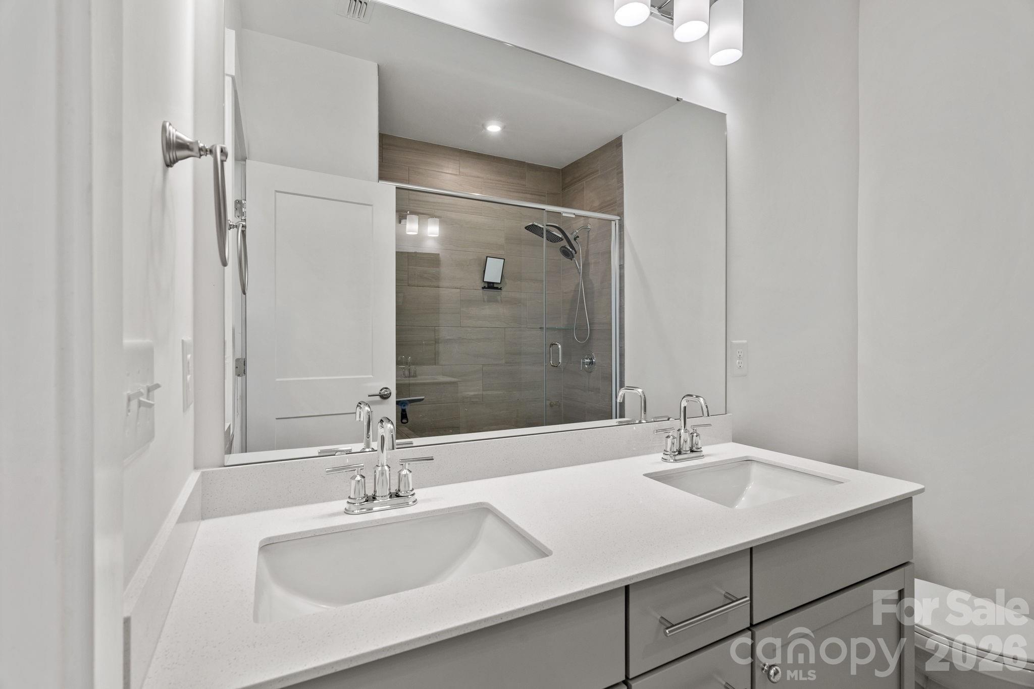 4012 Capital Ridge Charlotte, NC 28205 - Photo 16 of 28 a bathroom with a sink and a mirror