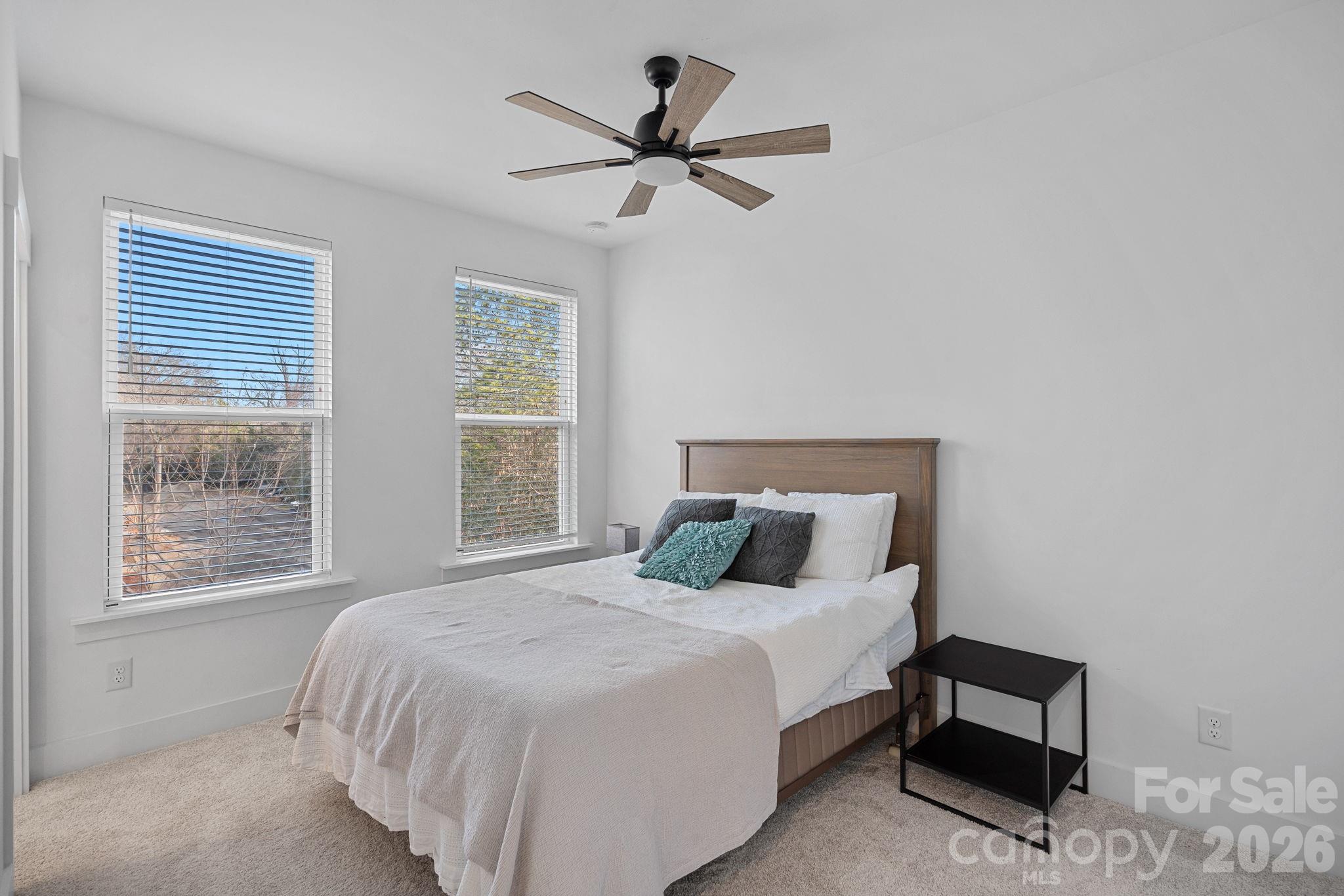 4012 Capital Ridge Charlotte, NC 28205 - Photo 18 of 28 a bedroom with a bed and window