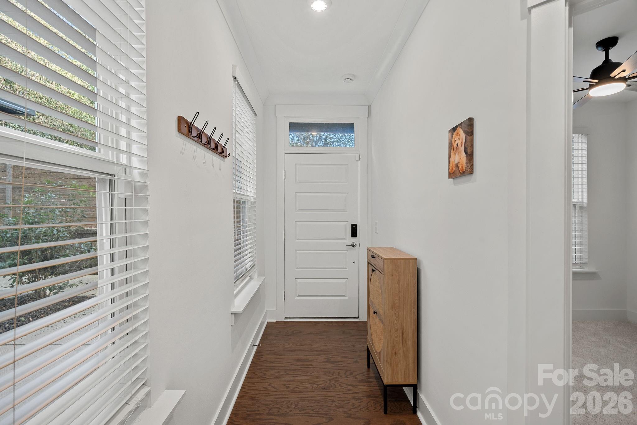 4012 Capital Ridge Charlotte, NC 28205 - Photo 2 of 28 a view of hallway with stairs and wooden floor