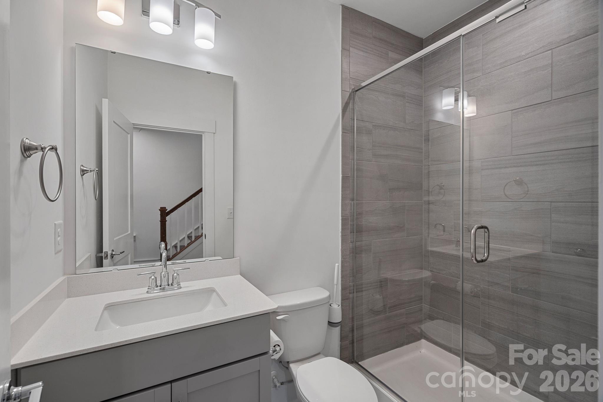 4012 Capital Ridge Charlotte, NC 28205 - Photo 21 of 28 a bathroom with a sink toilet and shower
