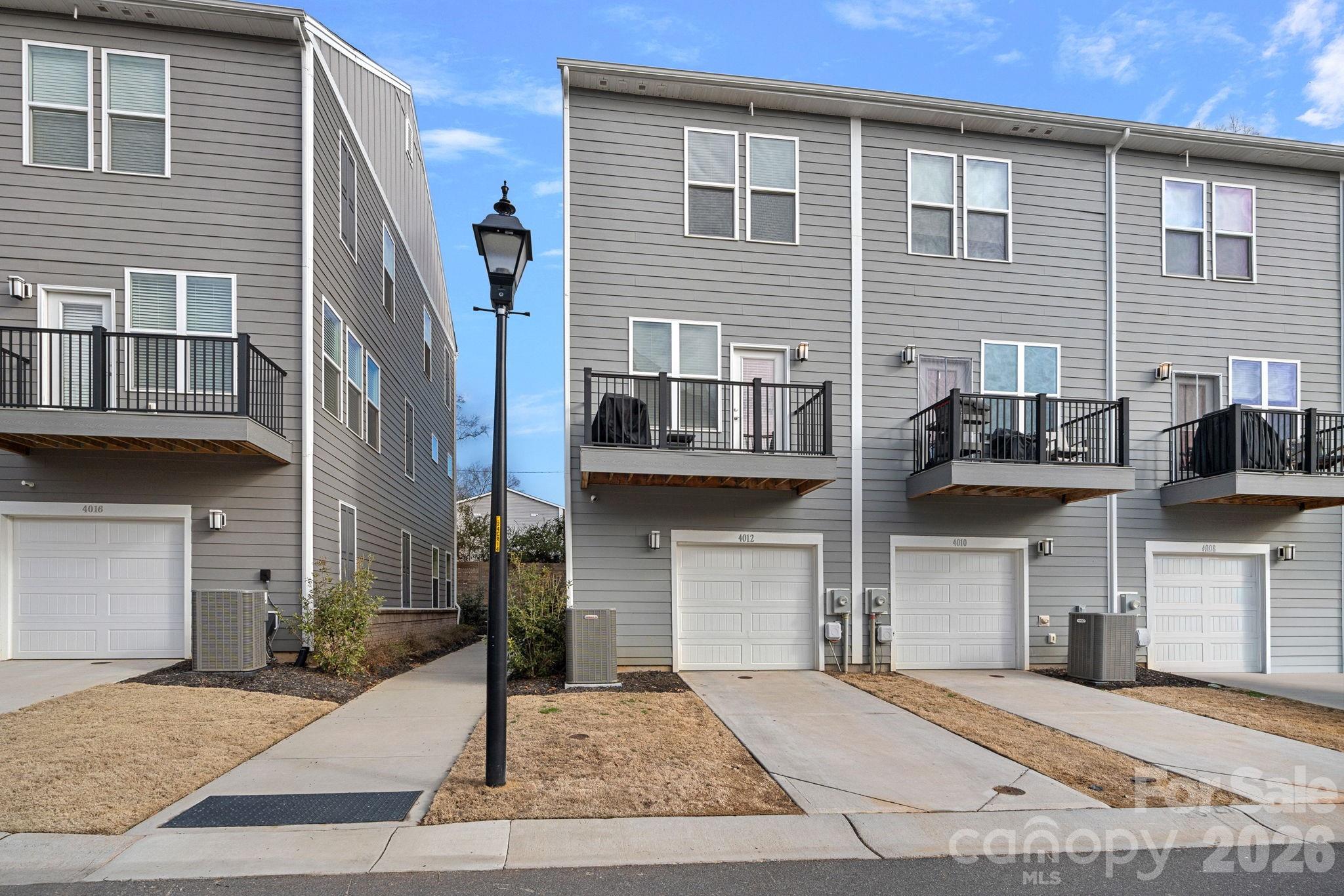 4012 Capital Ridge Charlotte, NC 28205 - Photo 22 of 28 a front view of a house with garage