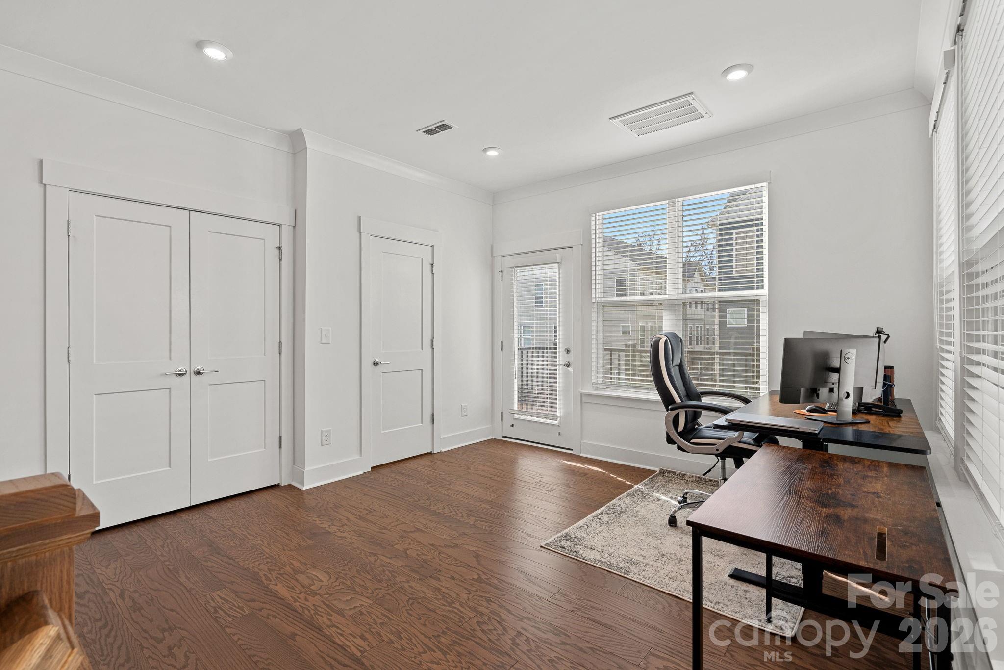 4012 Capital Ridge Charlotte, NC 28205 - Photo 4 of 28 a view of a workspace with furniture and a window