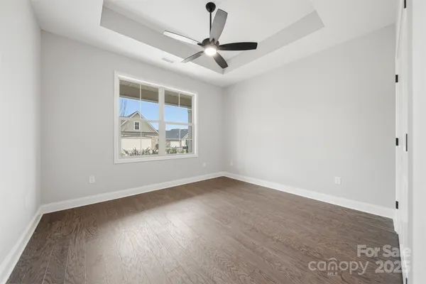 wooden floor in a hall with a window
