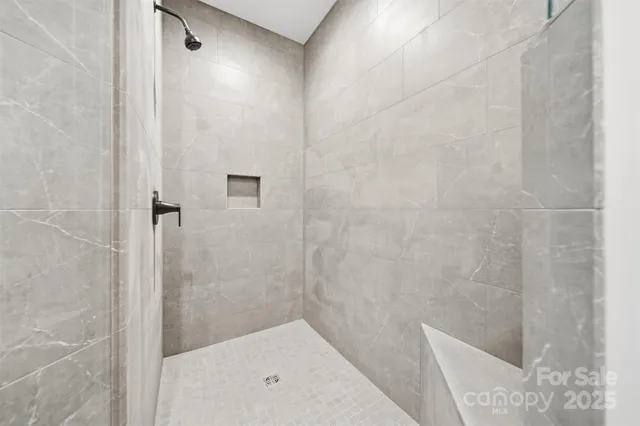 a bathroom with a shower and toilet